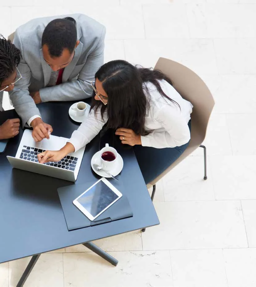 Team working together around a laptop