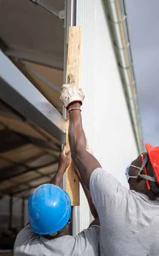Construction workers installing a structure